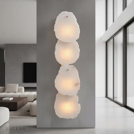Esker wall lamp with alabaster marble and copper glowing in a modern living room