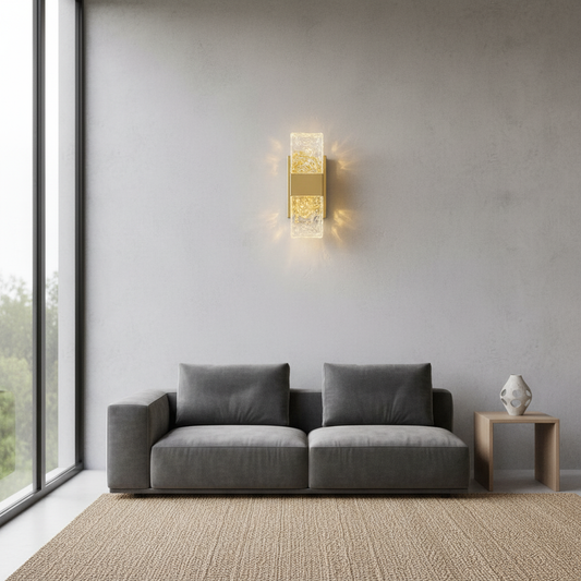 Zig Wall Lamp by Lucera glowing in modern living room with gold stainless steel frame