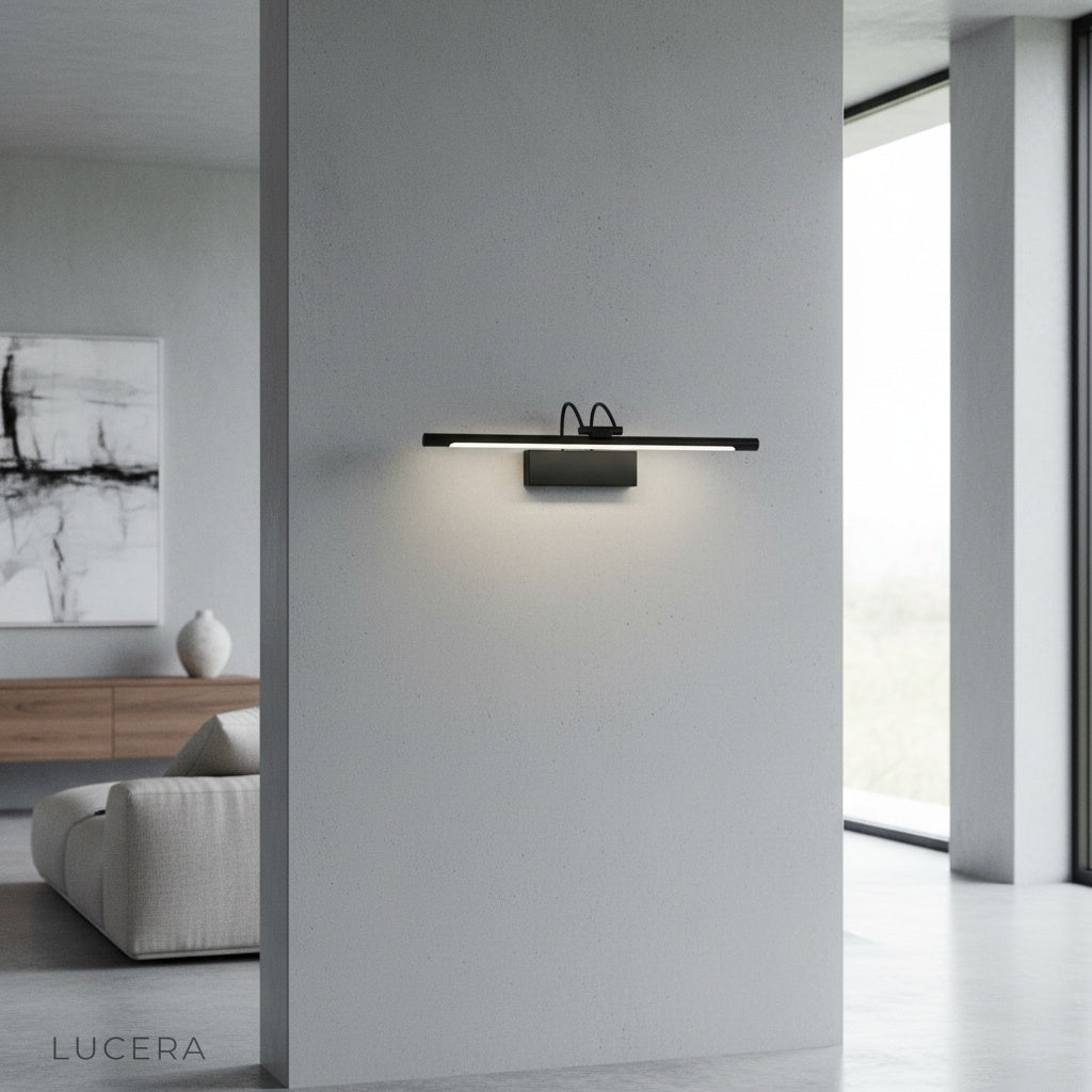 modern black Alluvium wall lamp illuminating a sleek bathroom vanity mirror