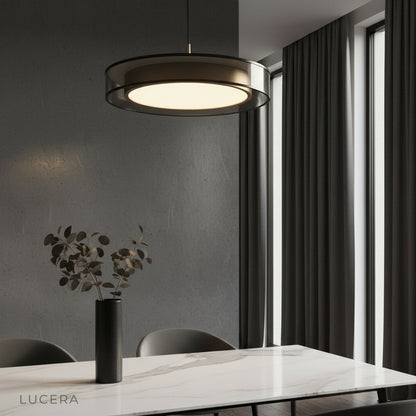 Alaric ceiling light with layered glass rings glowing in a modern living room