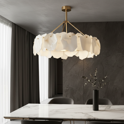 Spindle Alabaster Chandelier glowing in modern living room with copper accents