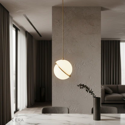 Igneous pendant light glowing over modern dining table in stylish living room