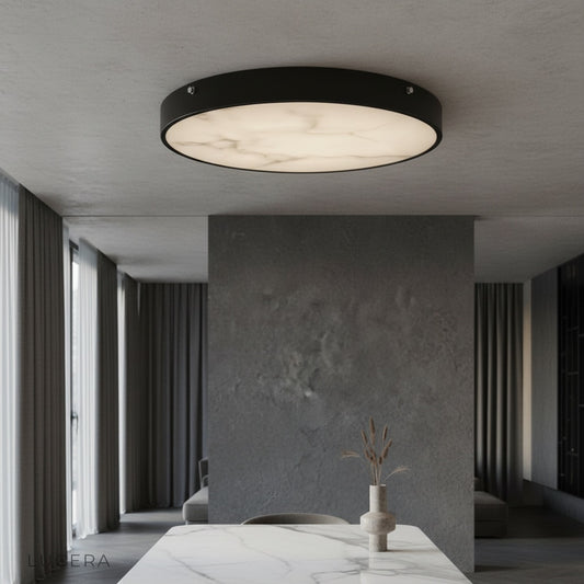 Berenice ceiling light glowing in modern living room with marble diffuser and brass accents