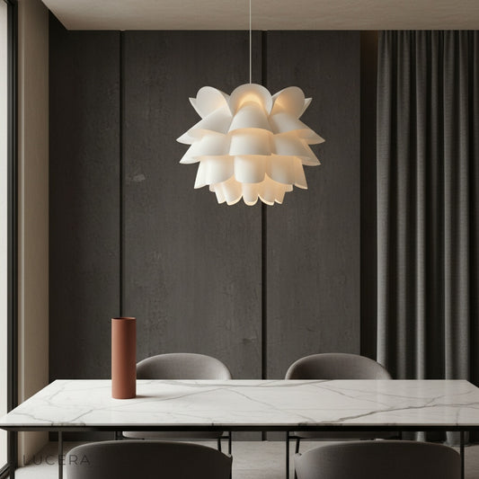 Oblation lotus-inspired white pendant light illuminating a modern dining room