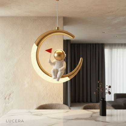 Jaune Brilliant astronaut moon pendant light glowing in a modern kids bedroom
