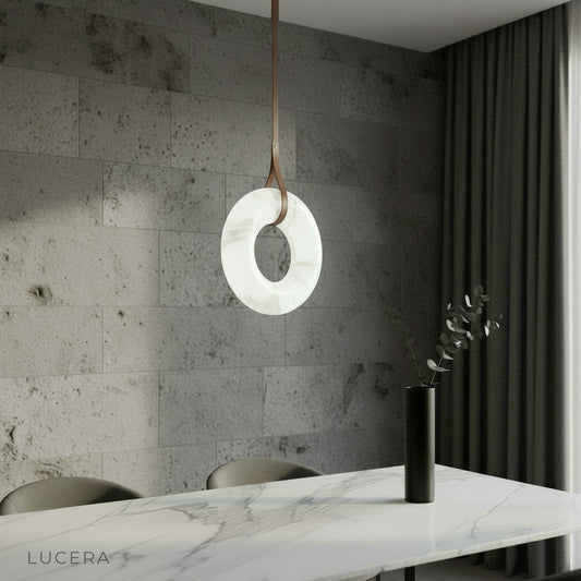 Helix alabaster pendant light glowing above dining table in modern living room
