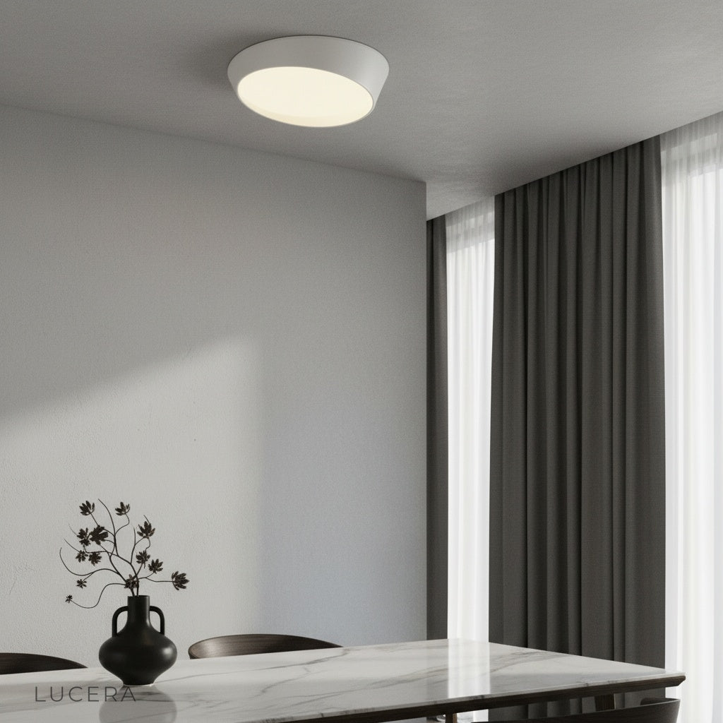 modern alabaster ceiling light glowing in minimalist living room with soft ambient lighting