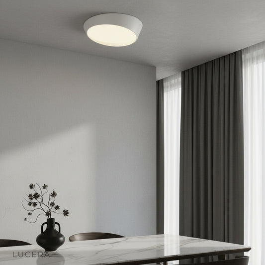 modern alabaster ceiling light glowing in minimalist living room with soft ambient lighting