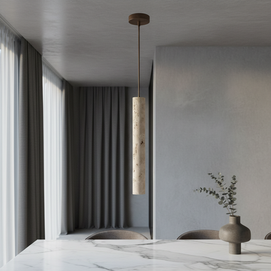 Triumph pendant light glowing over modern dining table in warm travertine finish