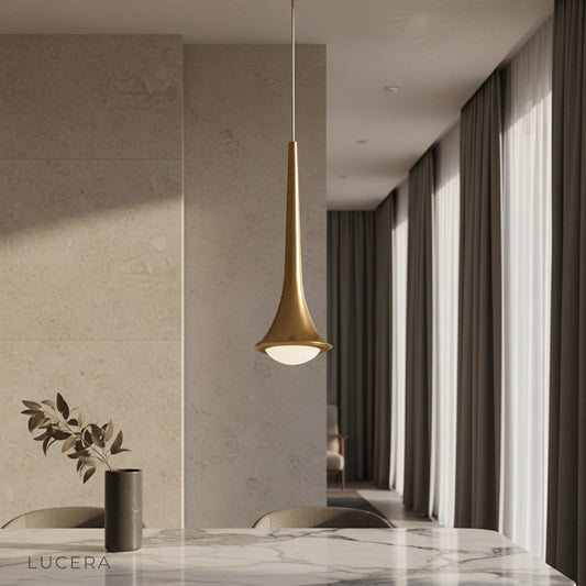 modern ethereal pendant light glowing above a contemporary living room sofa