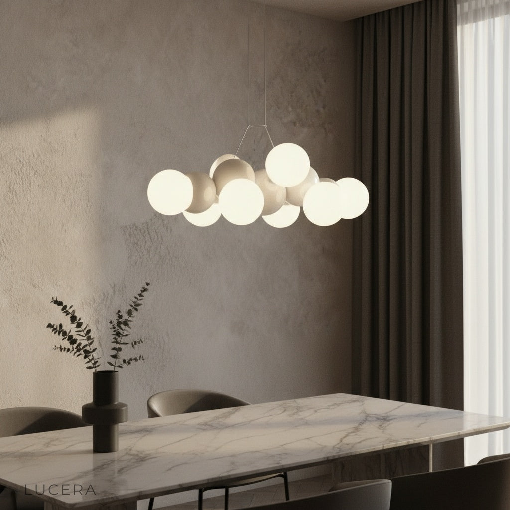 modern Fascia pendant light with frosted glass orbs illuminating a minimalist living room