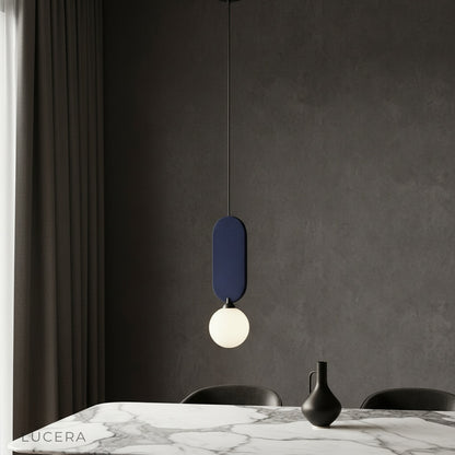modern Karat pendant lamp illuminating a cozy dining room with warm ambient light