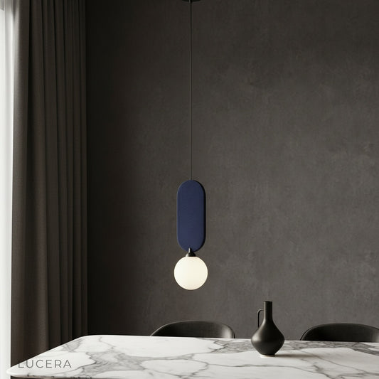 modern Karat pendant lamp illuminating a cozy dining room with warm ambient light