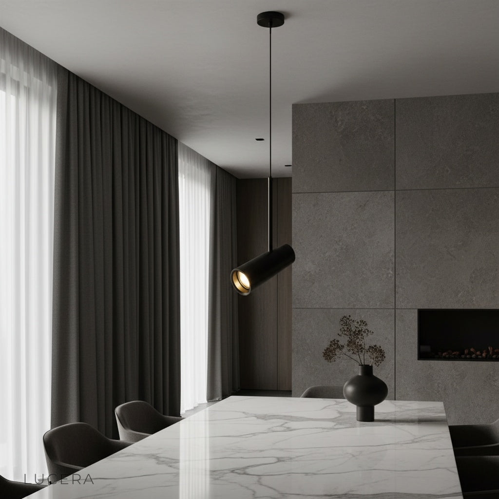 Bistre pendant light illuminating modern living room with sleek aluminum cylinder shades