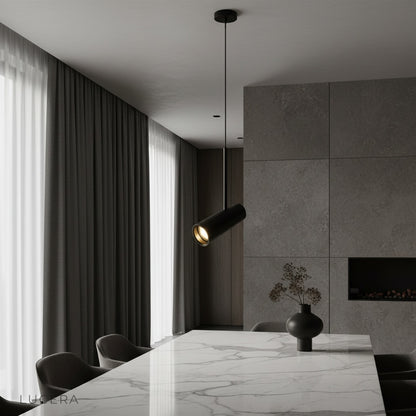 Bistre pendant light illuminating modern living room with sleek aluminum cylinder shades