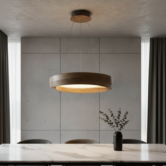 Tenon pendant light with wood-like metal frame glowing above modern dining table