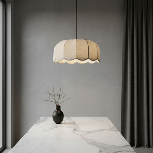 Zefiro pendant light with fabric shade glowing warmly above a modern living room seating area