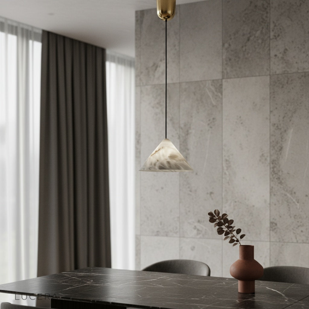 Herald Alabaster Pendant Light glowing softly above a modern dining table in a serene living room