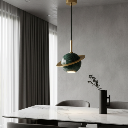 polished green marble pendant light with copper ring over bedside table