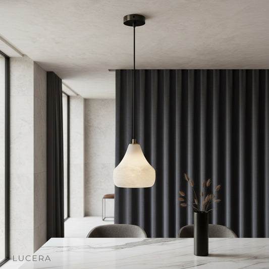 ivory alabaster pendant light glowing over modern living room sofa