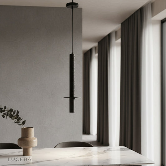 Sally Modern Travertine Pendant Light glowing over a kitchen island with bar stools