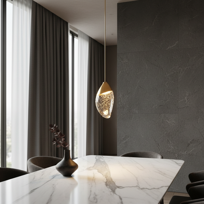 Font pendant light glowing warmly above a modern living room seating area