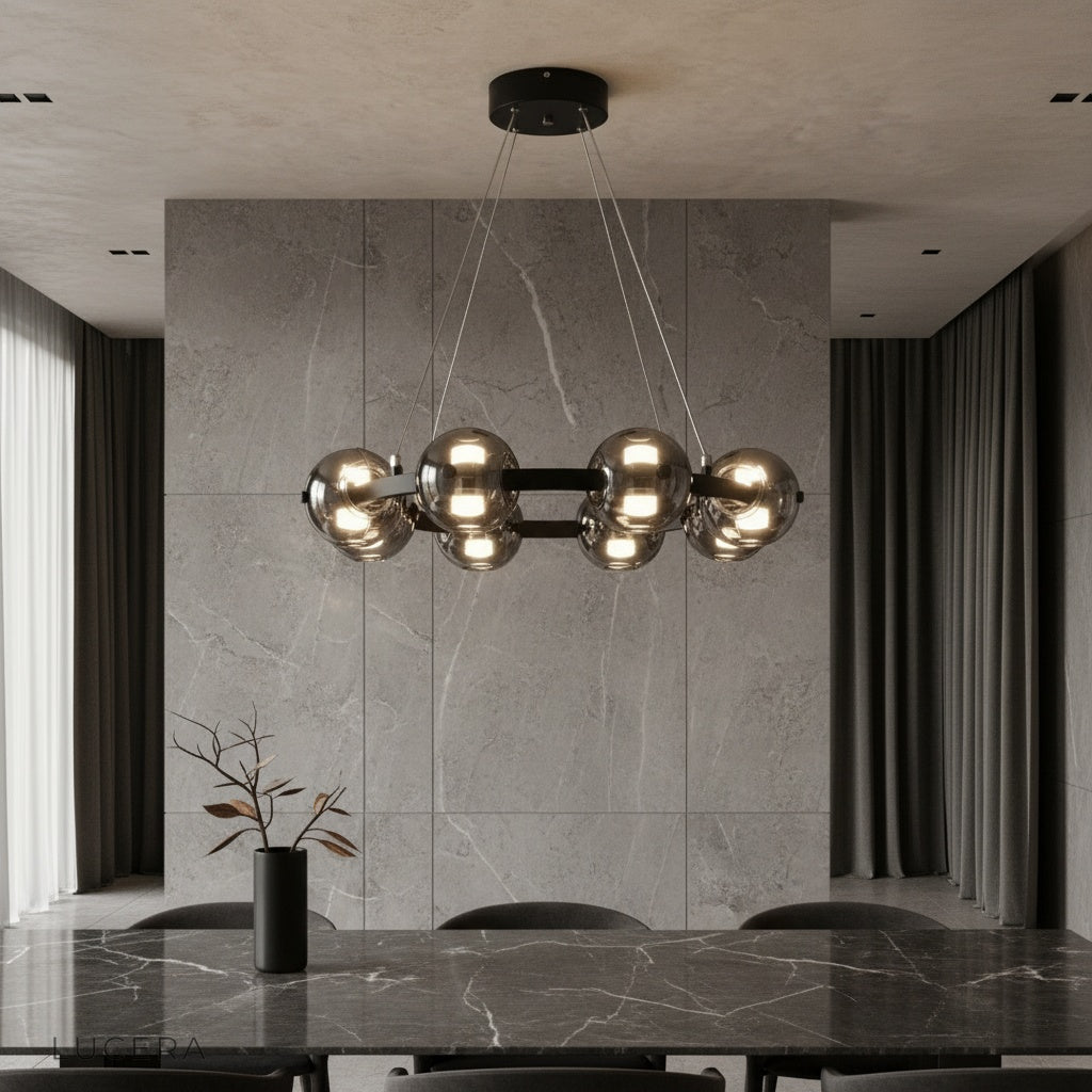 Jive Round Chandelier with smoked glass orbs illuminating a modern dining room
