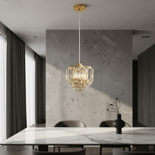 Diamond pendant light illuminating modern living room with brass frame and crystal tiers