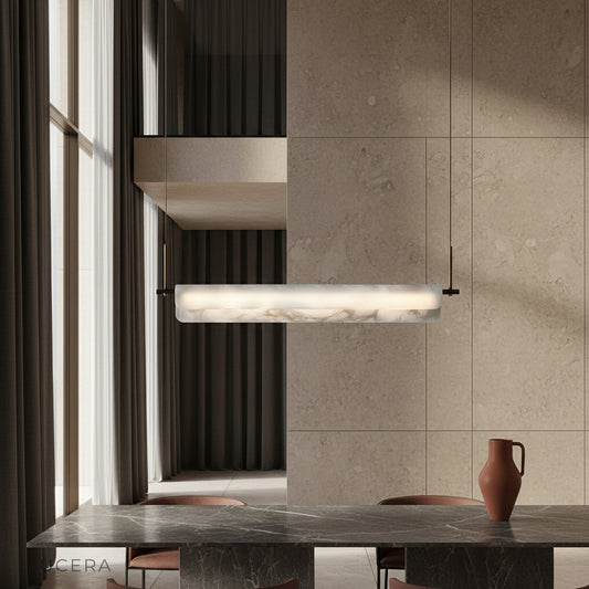 Parlor alabaster pendant light glowing above a modern dining table in a bright living room
