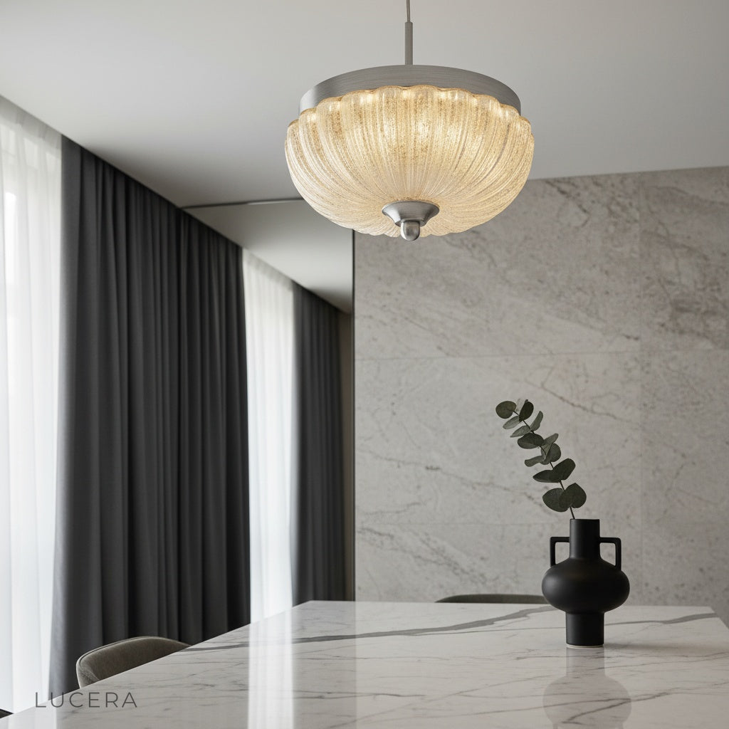 modern brass and glass ceiling light illuminating a cozy living room