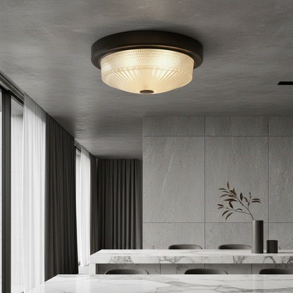 Veneration ceiling light illuminating elegant living room with bronze metal base and frosted glass shade