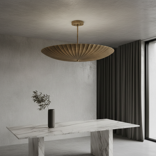 Motion Pendant Light by Lucera glowing above a modern dining table in a bright living room