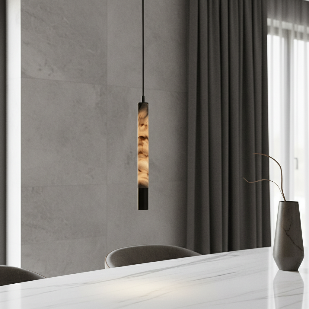 Yseult alabaster pendant light glowing over a modern dining table in a serene neutral-toned room