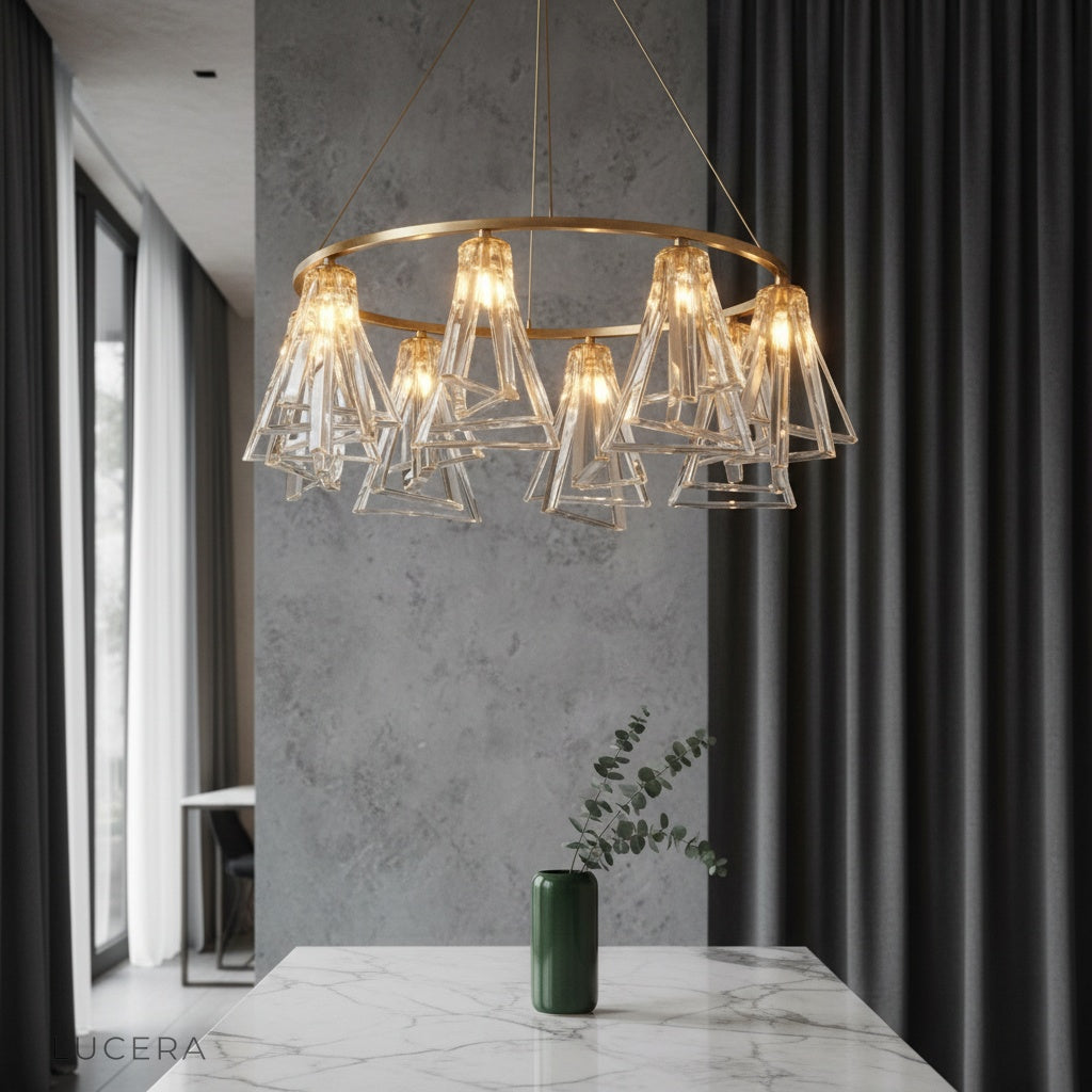Bruma Chandelier by Lucera glowing above a modern dining table in an elegant entryway