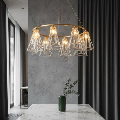 Bruma Chandelier by Lucera glowing above a modern dining table in an elegant entryway