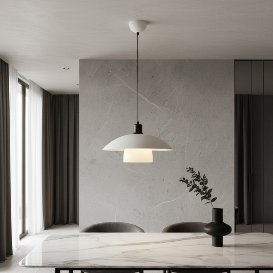 Eburnean pendant light glowing above Japandi dining table with wooden chairs