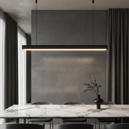 Winslow Pendant Light minimalist aluminum fixture illuminating modern living room