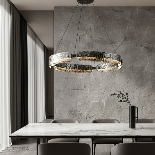 modern iron ring chandelier illuminating dining room with glass shades
