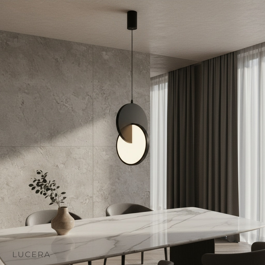 modern overlapping disc pendant light illuminating dining area with warm ambient glow