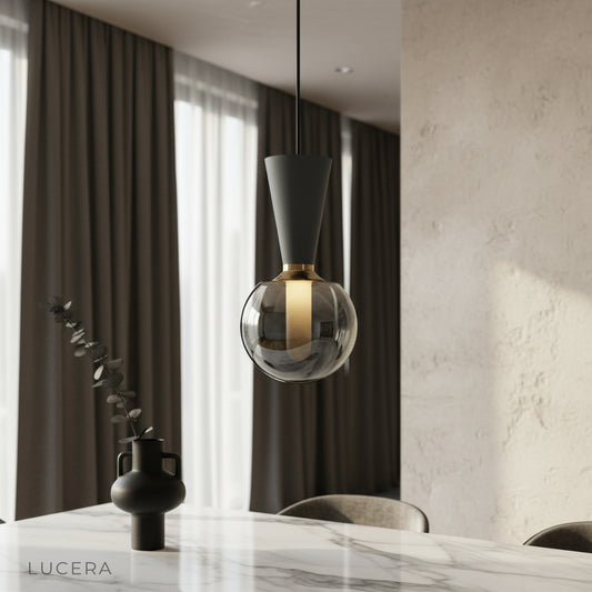 Ivan pendant light glowing over modern dining table in industrial-chic living room