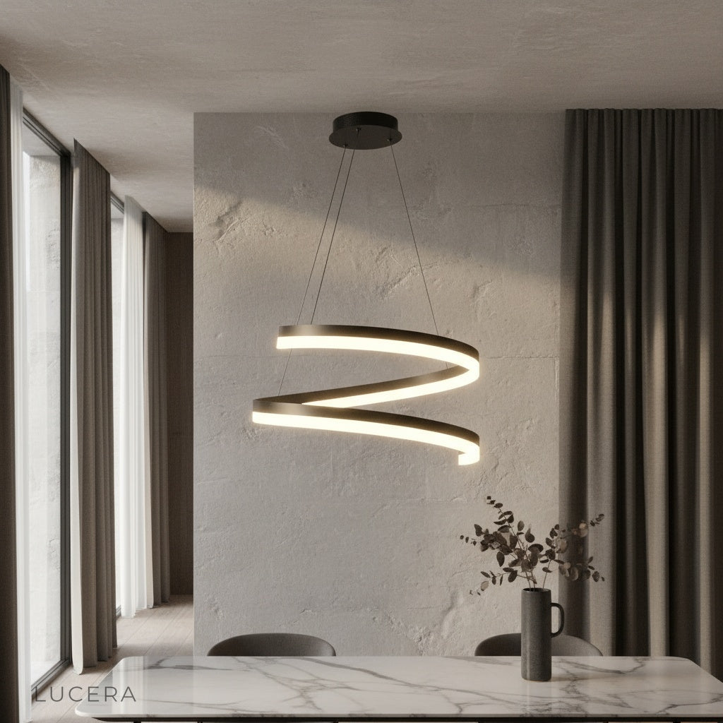 Hypnotize pendant light glowing above modern dining table in open-concept living room