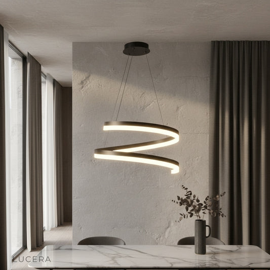 Hypnotize pendant light glowing above modern dining table in open-concept living room