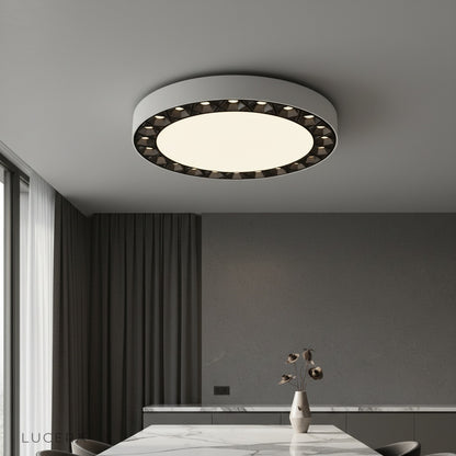 Modern Alonzo ceiling light glowing in contemporary living room with white and dark accents