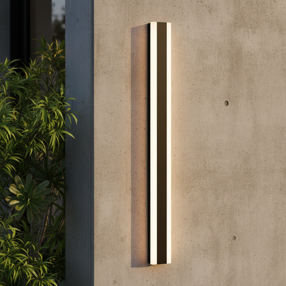 Yara black smart outdoor LED wall lamp illuminating a modern patio entrance at dusk