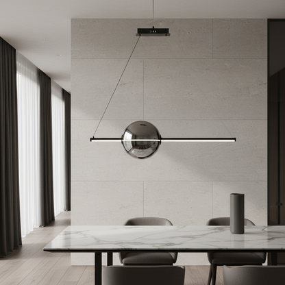 Bjorn modern glass LED chandelier glowing above a dining table in a minimalist living room