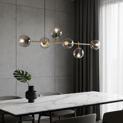 Dag glass ball LED pendant light illuminating a modern dining room with three hanging shades