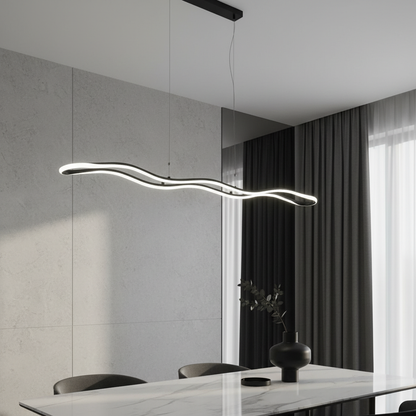 Skadi Wave LED pendant lamp glowing above modern dining table in bright living room