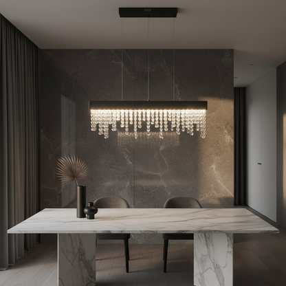 Sol black and gold chandelier illuminating a modern dining room with linear LED strip