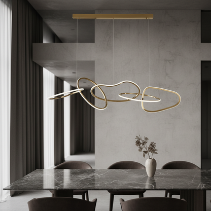 Bello Gold Crystal Chandelier illuminating a modern dining room with warm LED glow