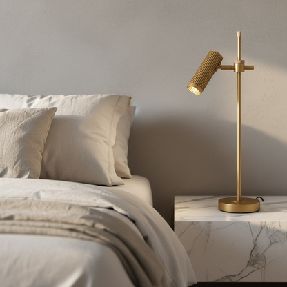 Moto bronze adjustable table lamp on modern wooden bedside table in cozy bedroom